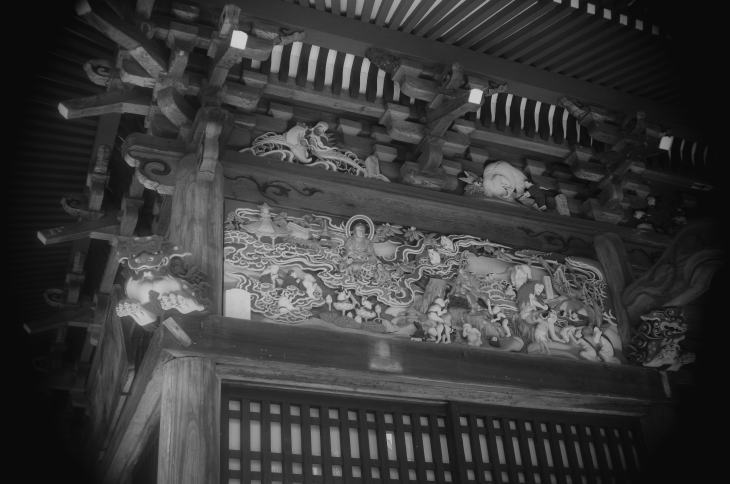 carving on a Japanese Buddhist temple depicting heaven and hell.