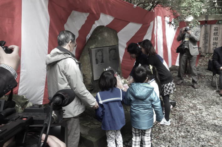 Local Hakone residents lay flowers at the Kaempfer-Birnie Monument during the 29th Kaempfer & Birnie Festival.